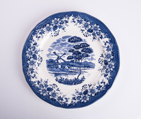 plate or flowers on plate painted by hand on background.