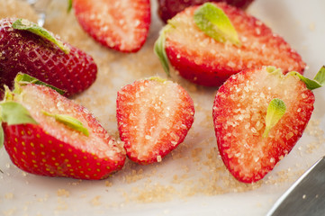 strawberries cut with sugar and mint
