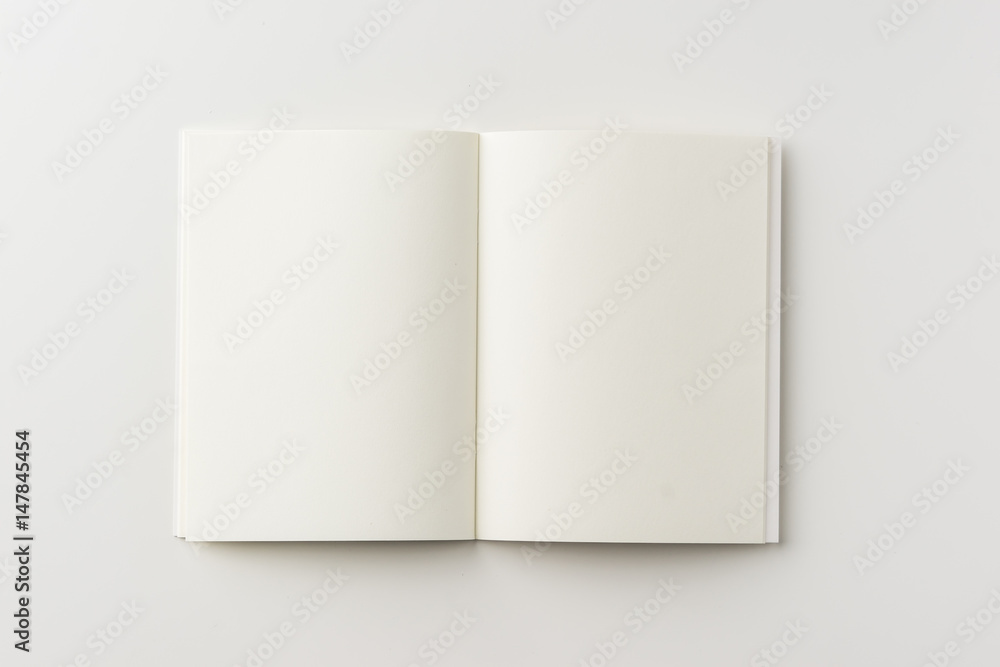 Wall mural business concept - top view of blank notebook on white background desk for mockup