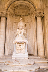 Fototapeta premium Rome, Italy. The statue of the sitting goddess Roma, the patroness of Rome in the courtyard of the Conservatory's palace, 117-138 AD.