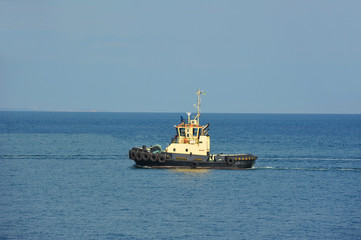 Tugboat in harbor quayside
