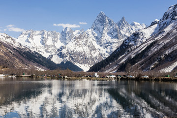 Lake and high mountains in clear weather, traveling and hiking.