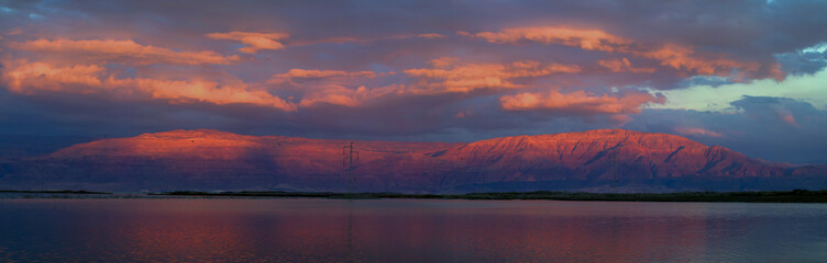 Sunset at the Dead Sea overlooking the mountains of Jordan