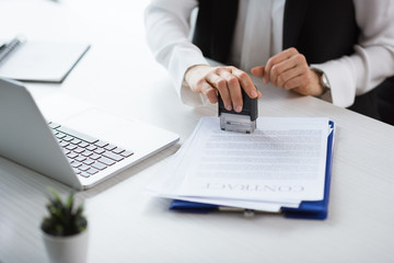 businesswoman stamping contract