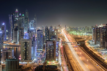 Naklejka na ściany i meble Scenic view from roof top of Dubai's Jumairah Lakes Towers (JLT) by night