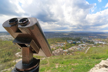 Stationary observation binoculars on the mountain slope