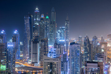 Fototapeta na wymiar Scenic view from roof top of Dubai's Jumairah Lakes Towers (JLT) by night