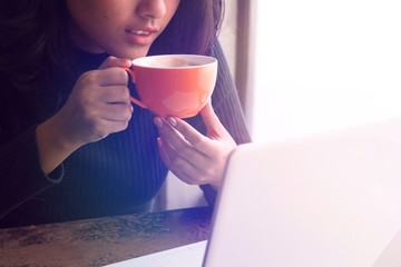 Asian woman working in coffee shop 