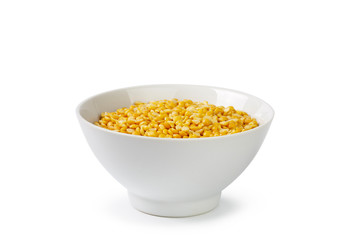 Dry yellow split peas isolated on white.