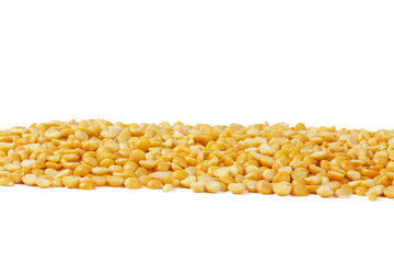 Dry yellow split peas isolated on white.