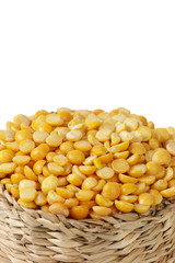 Dry yellow split peas isolated on white.