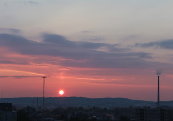 Naklejka premium Sunrise with warm clouds over city Ceske Budejovice