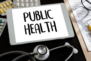 PUBLIC HEALTH  Professional doctor use computer and medical equipment all around, desktop top view