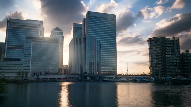 Sunset over modern glass skyscrapers timelapse