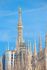 Details of the Milan Cathedral, the spiers and the Madonna