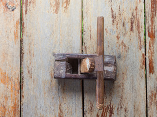 Old wooden plane for working on a wooden table background.