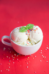 Ice cream in a cup on a red background