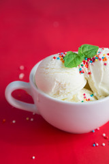 Ice cream in a cup on a red background