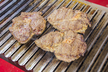 Grilled meat steak on the grill