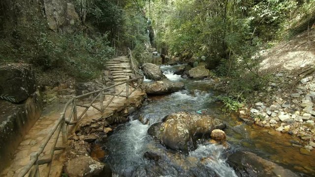 Inside cable car view of Datanla waterfall in Da Lat, Vietnam. Cableway over the water in the jungle
