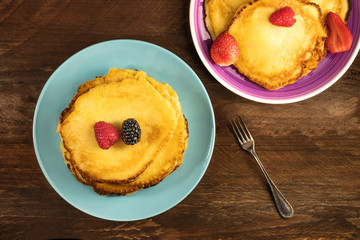 Freshly baked homemade pancakes with fresh fruit
