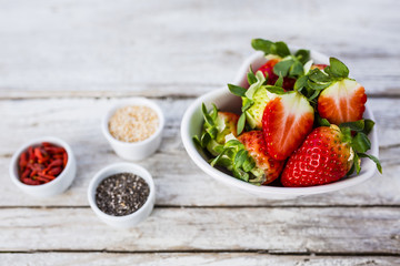 Strawberries and chia seeds grains quinoa. Healthy and delicious super diet. 