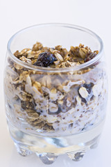 Granola with yogurt in glass cup
