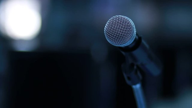 close-up Microphone on tripod in recording studio with floodlights or Shallow DOF. 
