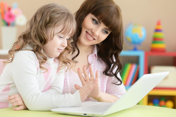 Mother and daughter doing lessons 
