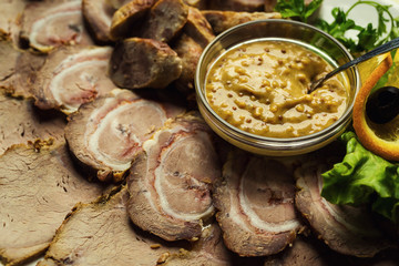 Meat assortment of beef, sausage and ham with greens,meat plate,Sliced boiled ham sausage,Meat with mustard sauce,Cold cuts