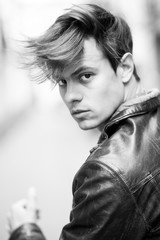 Confident and handsome young man in the street