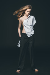 Fototapeta premium girl wearing white male shirt