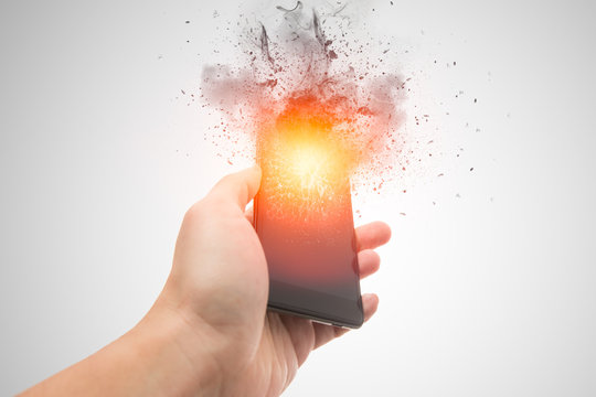 smartphone explosion, blow up cellphone battery or explosive mobile phone or explode burst fire burn out smart device with dispersion effect.