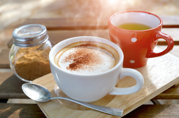 Hot cappuccino coffee in morning time.