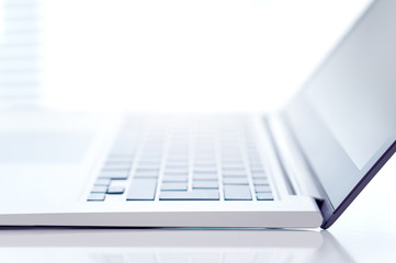 Modern marketing, small business and technology background. Close up of a blurry laptop with free...