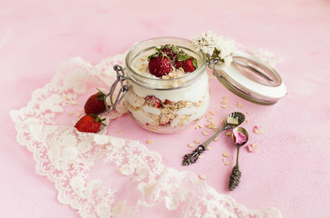 Oatmeal in a jar with strawberries and coconut