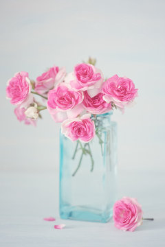 Close-up floral composition with a pink roses. Beautiful fresh pink roses on a table. 