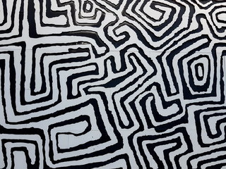Wiggly black and white patterns on wall