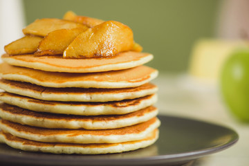 Pancakes with apple on table. Breakfast, snacks. Pancakes Day.