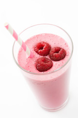 Raspberry smoothie in glass isolated on white background
