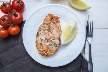 Salmon steak with herbs and lemon