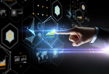 close up of hand pointing finger to virtual chart
