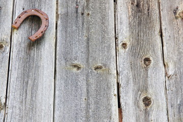 Wood texture background with rusted horseshoe