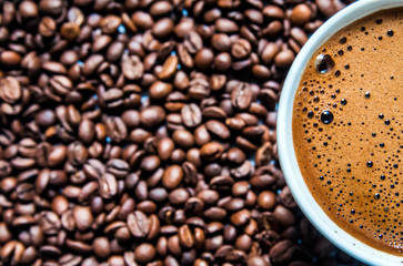 Coffee cup and coffee beans on table, top view, love coffee, Brown coffee beans isolated on white background, Hot Coffee cup with Coffee beans