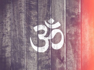 Om symbol hindu on wooden table - Oriental culture - yoga and India om sign - obrazy, fototapety, plakaty
