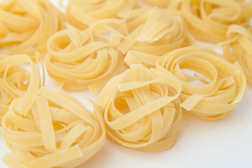 Tagliatelle on white background