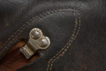 Hiking shoe detail, brown leather with metal hook