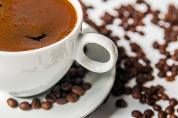 Coffee cup and beans on a white background.