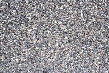 Surface of grey textured stone wall