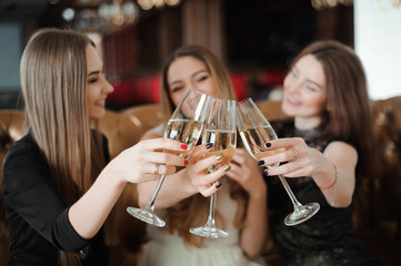 holidays, nightlife, bachelorette party and people concept - smiling women with champagne glasses